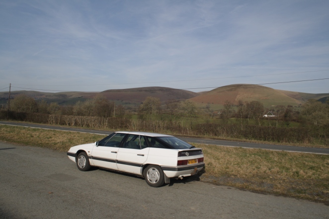 XM pauses in Welsh border country. Stunning. View and car.
