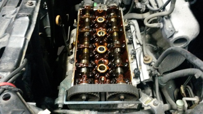 Off with the top cover. How old is the timing belt?